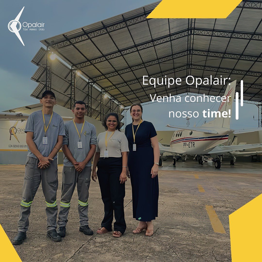 Equipe Opalair em hangar ao lado de aeronave